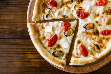 delicious pizza with meat, cheese and mushrooms	