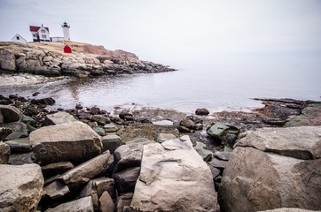 Fototapeta na wymiar Portland Head Lighthouse in Portland Maine is one of Maine's most famous historical landmarks