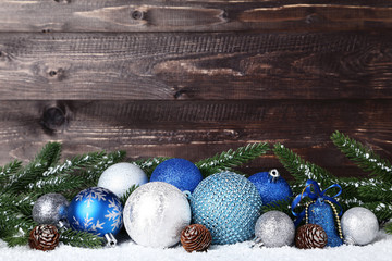 Christmas decorations with fir tree branches on wooden background