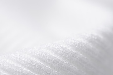 White sweater fabric textile material texture macro blur background