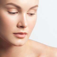 Obraz premium Young beautiful woman with clean perfect skin close-up