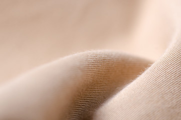 Jean marron tissu textile texture bouton macro arrière-plan flou