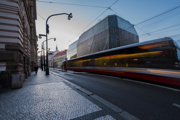 Fototapeta premium Prague, the tram departs from the stop in the background of the National Theater building