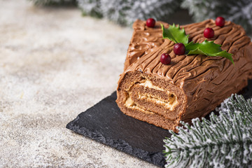 Christmas yule log cake. Traditional chocolate dessert