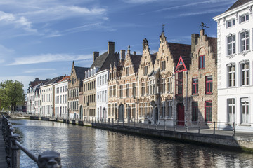 Naklejka premium Sunny cityscape of old historical Belgium town Bruges. Urban landscape photography.