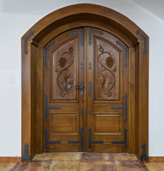 Double door made of wood with iron decoration