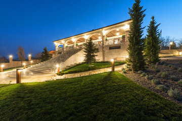 Fototapeta premium Exterior of rustic house, villa by night