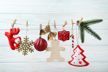 Christmas decorations with fir-tree branch hanging on rope