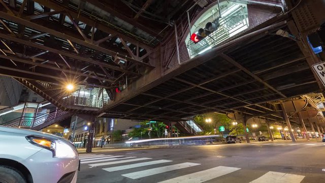 Night timelapse of Chicago street and aerial subway metro train system