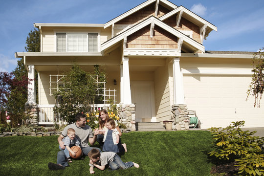 Family In Front Of A House