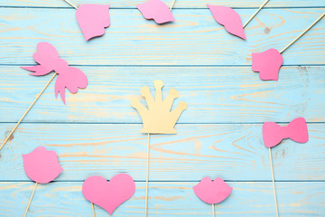 Paper booth props for party on blue wooden table
