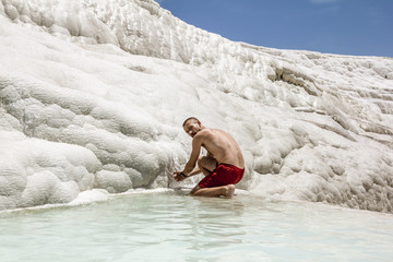 Man posing near the thermal springs and travertines of Pamukkale
