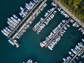 Top view at sea bay with pier and many boats and yachts