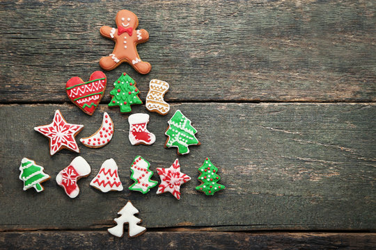Christmas tree made from gingerbread cookies on wooden table