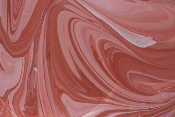 Photos of manufacturing a paint composite color. Mixing acrylic paint in different colors. Marbleized.