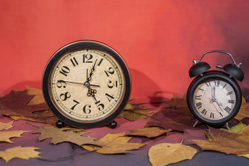 Daylight Saving Time. Wall Clock going to winter time. Autumn abstraction.