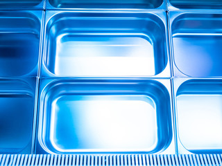 Equipment for grocery stores. Showcase-refrigerator. Steel pallets for food. Food production equipment. Industrial refrigerator. © Grispb