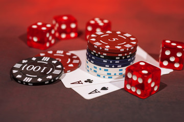 Casino abstract photo. Poker game on red background. Theme of gambling