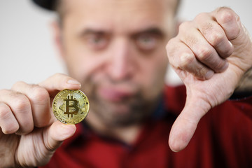 Man having bitcoin coin