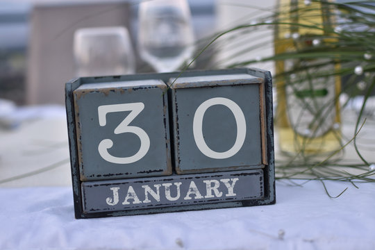 Wood blocks in box with date, day and month 30 January. Wooden blocks calendar