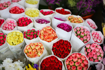 Several bouquets of carnation ready for sale in a street flower market