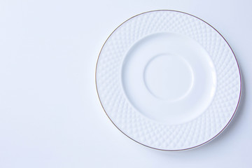 Empty clean plate of luxury porcelain with golden line at white background