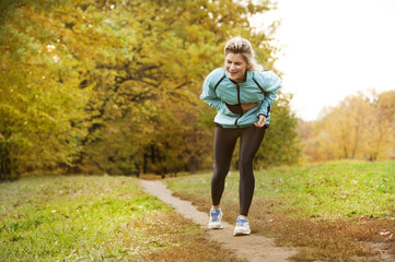the athlete hurts in his side while he is running, and he is in pain and massaging his sick side in...