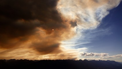 Fototapeta na wymiar Wildfire smoke meets blue sky.