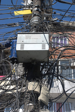 A mass tangle of electrical wires in a favella in Rio de Janiero, Brazil