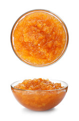 Set with bowls of delicious peach jam on white background