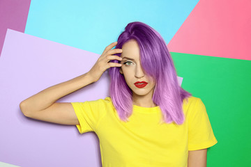 Portrait of young woman with dyed straight hair on colorful background. Trendy hairstyle design