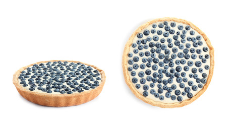 Set with delicious blueberry cheesecake on white background