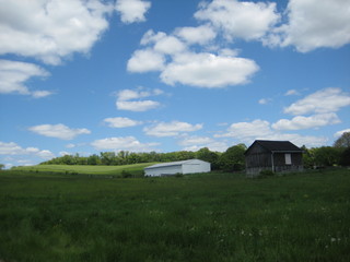 Countryside with shed and clouds