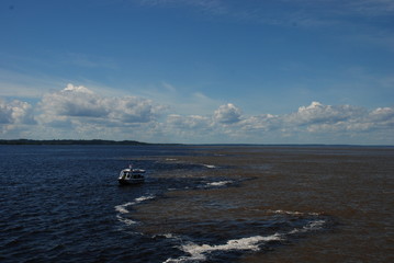 The Meeting of the Waters in Brazil where the Rio Negro and Rio Solimões run alongside each other without mixing.