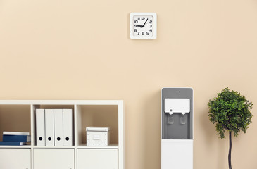 Modern water cooler in stylish office interior
