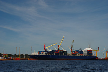 A container ship being unloaded at the Port of Manuas on the Rio Negro in Brazil.