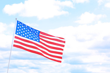 Woman with American flag outdoors on cloudy day. Space for text