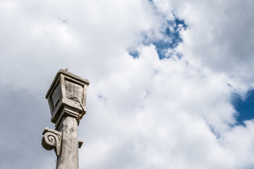 Fototapeta na wymiar Wooden lantern sculpture and cloudy sky