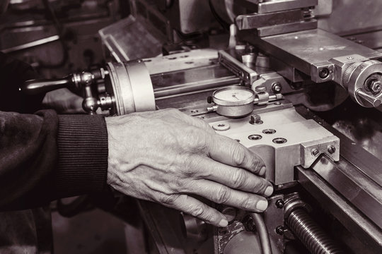 Old Mans Hand On An Old Lathe Machine