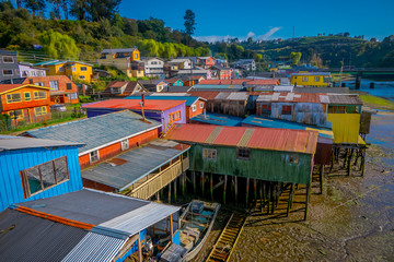 Fototapeta na wymiar Above beautiful and colorful houses on stilts palafitos in Castro, Chiloe Island