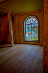 Indoor view of historic church of Nercon, with a gorgeous mitral windows in catholic temple located in the chilota commune of Castro southern Chile, World Heritage Site by Unesco