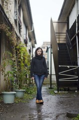 Japanese Girl poses on the street in Fussa, Japan. Fussa is a city located in Tokyo.
