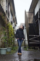 Japanese Girl poses on the street in Fussa, Japan. Fussa is a city located in Tokyo.