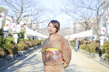 Japanese Girl poses on the street in Kamakura, Japan. Kamakura is an area located in Kanagawa where is a bit south of Tokyo.