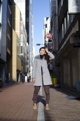 Obraz premium Japanese Girl poses on the street in Ginza, Japan. Ginza is a shopping city located in Tokyo.