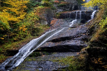 Delaware Township, Pike County, Pennsylvania, USA: Autumn foliage surrounds Dingman’s Falls, in...
