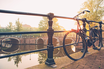 Bicycle parked by Amsterdam canal