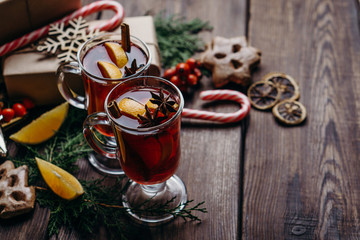 Winter holidays greeting card or poster template. Hot mulled wine, traditional gingerbread cookies...