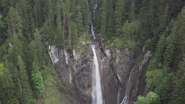 zoom out by drone from the scenic pochtenfall in the Bernese Oberland.
