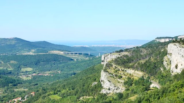 large highway concrete bridge over a wide valley near the sey